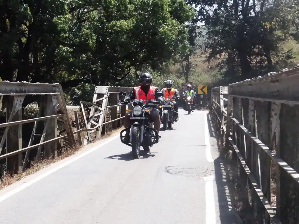 Southern India Motorcycle Tour 2 team crossing bridge scaled 1